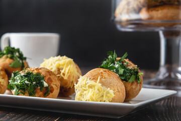 Turkish pastry filled with dill, parsley, cream cheese and cheddar cheese. Turkish name: Sakallı Pogaca or Saçaklı Pogaca