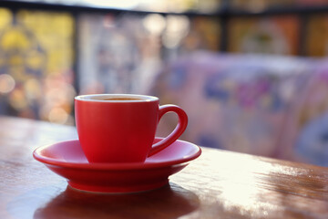 Cup of hot aromatic coffee on table in outdoor cafe. Space for text