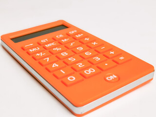 Close up orange calculator isolated on white background.