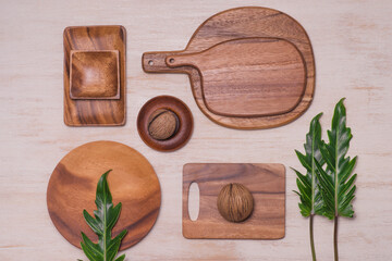 Set of kitchen utensils on vintage planked wood table from above, wooden background