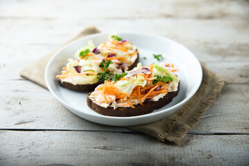 Homemade toast with cream cheese and vegetables