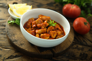 Traditional homemade chicken ragout with tomato sauce