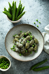 Homemade spinach gnocchi with green pea