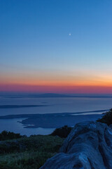 View from Velebit national park at mediterranean sea with island in evening twilight, Croatia