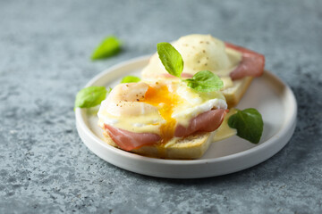 Traditional homemade Benedict eggs with ham