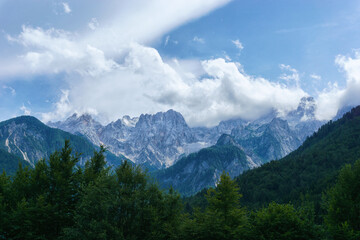 Fototapeta na wymiar Mountain landscape with forest and clouds in Julian Alps, Triglav National Park, Slovenia