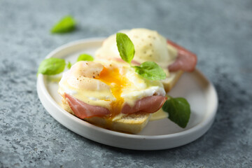 Traditional homemade Benedict eggs with ham