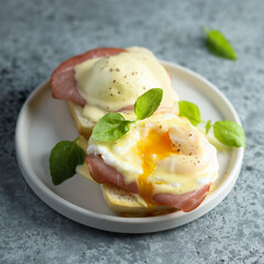 Traditional homemade Benedict eggs with ham