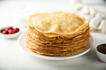 Traditional homemade crepes on a white plate