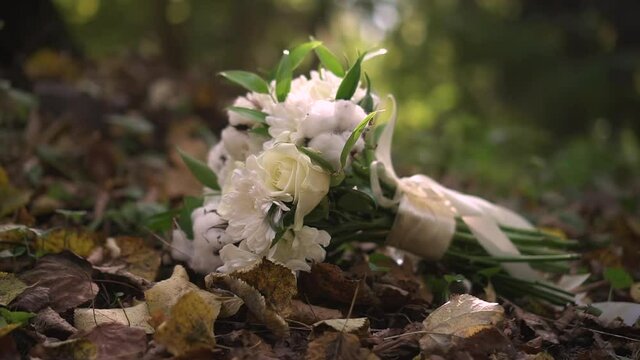 beautiful wedding bouquet lies on the leaves