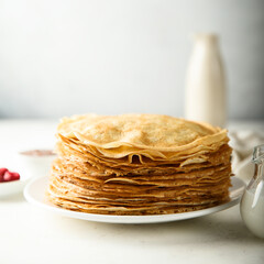 Traditional homemade crepes on a white plate
