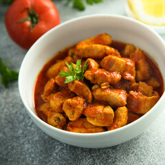 Traditional homemade chicken ragout with tomato sauce