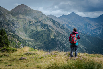 Fototapeta premium Hiker enjoing the view in the high mountains.
