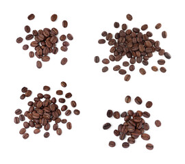 Set with roasted coffee beans on white background, top view