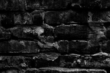 Fototapeta Dark moody rough brick wall for texture background obraz