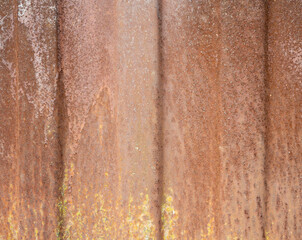 Corroded metal background. Rusted white painted metal wall. Rusty metal background with streaks of rust. Rust stains. The metal surface rusted spots. 