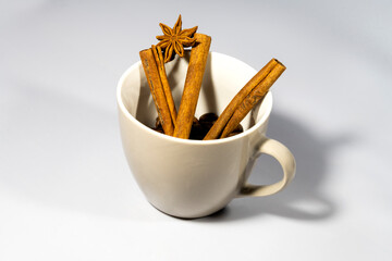 A cup of Christmas drink. Coffee with cinnamon and anise. Spiced coffee. Cinnamon coffee.
