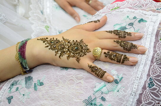 Close-up of the bride's hand with henna