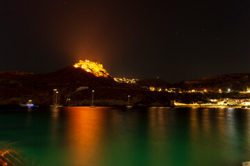 Naklejka na ściany i meble The castle of Kythira island at Greece at night as seen from Kapsali village.