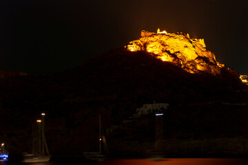 Fototapeta premium The castle of Kythira island at Greece at night as seen from Kapsali village.