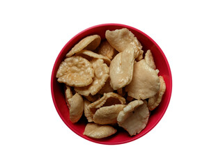 isolated picture of Crackers with a brown round shape in a red container or bowl, Indonesian traditional snack crackers