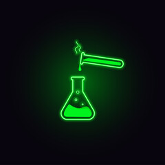 
Glass flasks with green liquid on a dark background. Neon effect of objects. The process of pouring liquid from a flask into a flask. For the design of scientific processes
