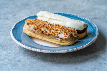 Group of Fench Delicious Dessert Eclairs in Plate.