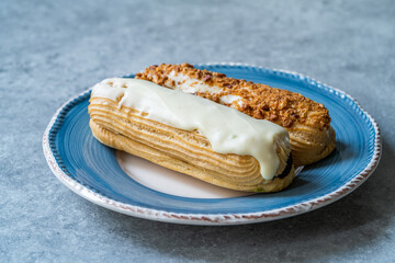 Group of Fench Delicious Dessert Eclairs in Plate.