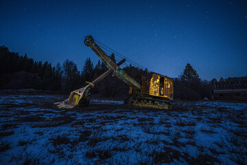 Old Excavator in a Field at Night