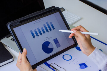 Account managers view company's past sales and expenses online on mobile and tablet, cropped images of working of their own company by self-checking and troubleshooting, business and finance concept.