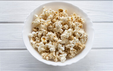 Popcorn on a plate. Caramel delicious popcorn. 