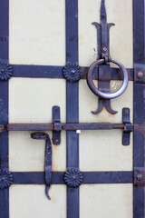 antique door with forged elements and a bolt