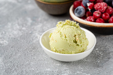 Close up of one scoop pistachio ice cream in bowl