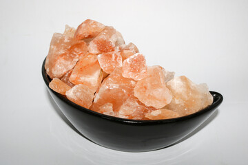 Pink salt on isolated white background.