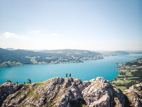 Two people standing on top of the Schoberstein summit at the Attersee in Upper Austria, Austria
