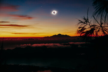 Solar eclipse on a colorful sky.