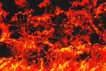 Fototapeta na wymiar A fire flame pattern with sparks on a black background. The texture of a campfire at night.