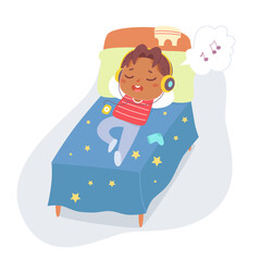 Boy listening music with headphones, cute child lying on bed to listen and enjoy sound