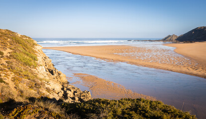 river mouth opening into the ocean