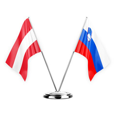 Two table flags isolated on white background 3d illustration, austria and slovenia