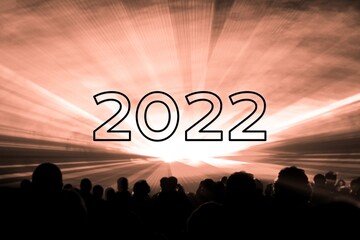 Happy new year 2022 orange laser show party people crowd. Luxury entertainment with audience...