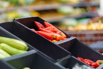 Red peppers on the shelves of a grocery supermarket. Sale of vegetables