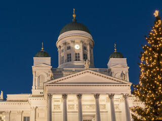 Fototapeta na wymiar Christmas tree on the background of St. Nicholas Cathedral in Helsinki.