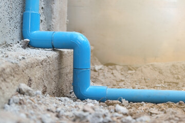 Blue PVC pipe line joint connection water for supplying water to use in homes close-up.