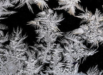 beautiful frosty patterns on the window glass