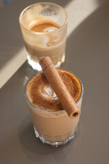 Special coffee with cinnamon in a glass glass