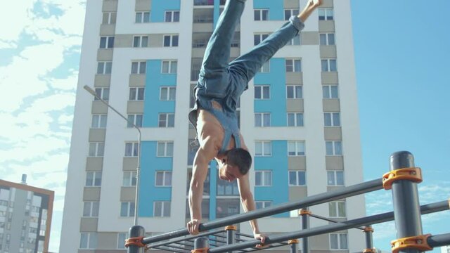 A man exercising on a sports ground