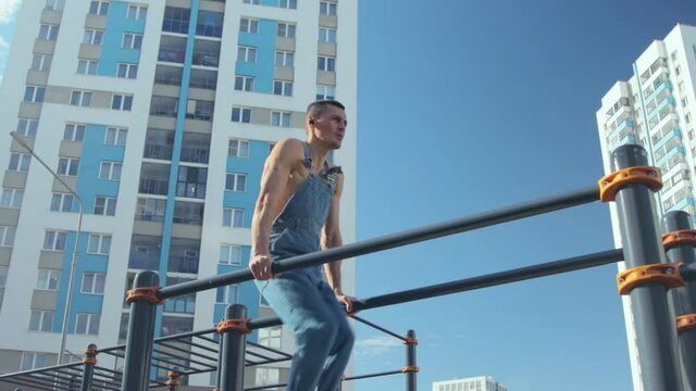 A man exercising on a sports ground