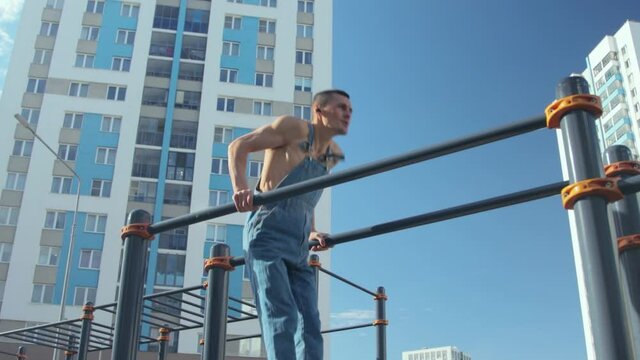 A man exercising on a sports ground