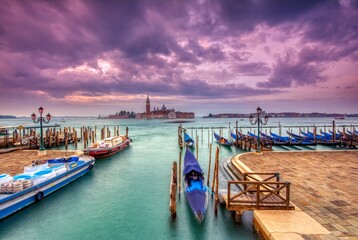 Fototapeta premium Gondolas moored by Saint Mark square, Venice, Italy, Europe.
